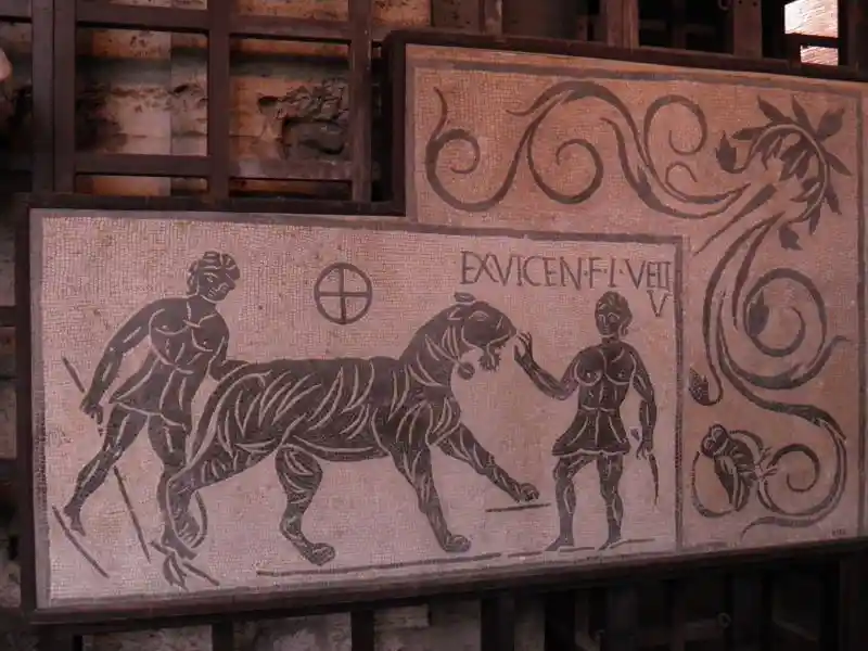 Black and white roman mosaic with solar cross symbol